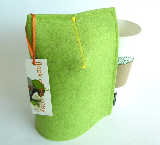 Mug cosy or warmer for 20oz takeout papercup or tall mug made in pistachio green wool felt with yellow stitching by flock of tea cosy