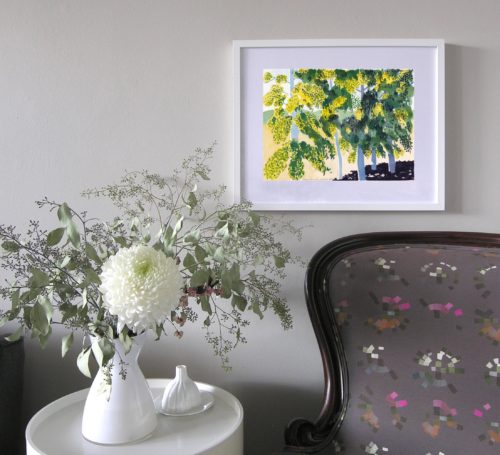 In situ image of watercolour painting of 5 birch trees on wall next to armchair